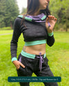 Women's matching two piece set, joggers and crop hoodie, black fabric with lavender accents, front view on model.