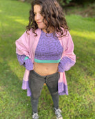 Organic cotton crop top, lavender fabric with geometric print, front view on female model.