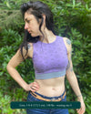 Organic cotton crop top, lavender fabric with sacred geometry print, front right view on slender female model.