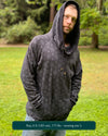 Organic cotton extra long unisex hoodie, black with sacred geometry print, front view of male model.