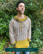 Organic cotton hoodie, un-dyed fabric with brown geo print, front view on male model.