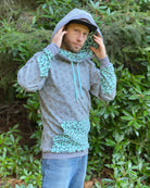 Organic cotton extra long unisex hoodie, grey with geo print, front right side view.