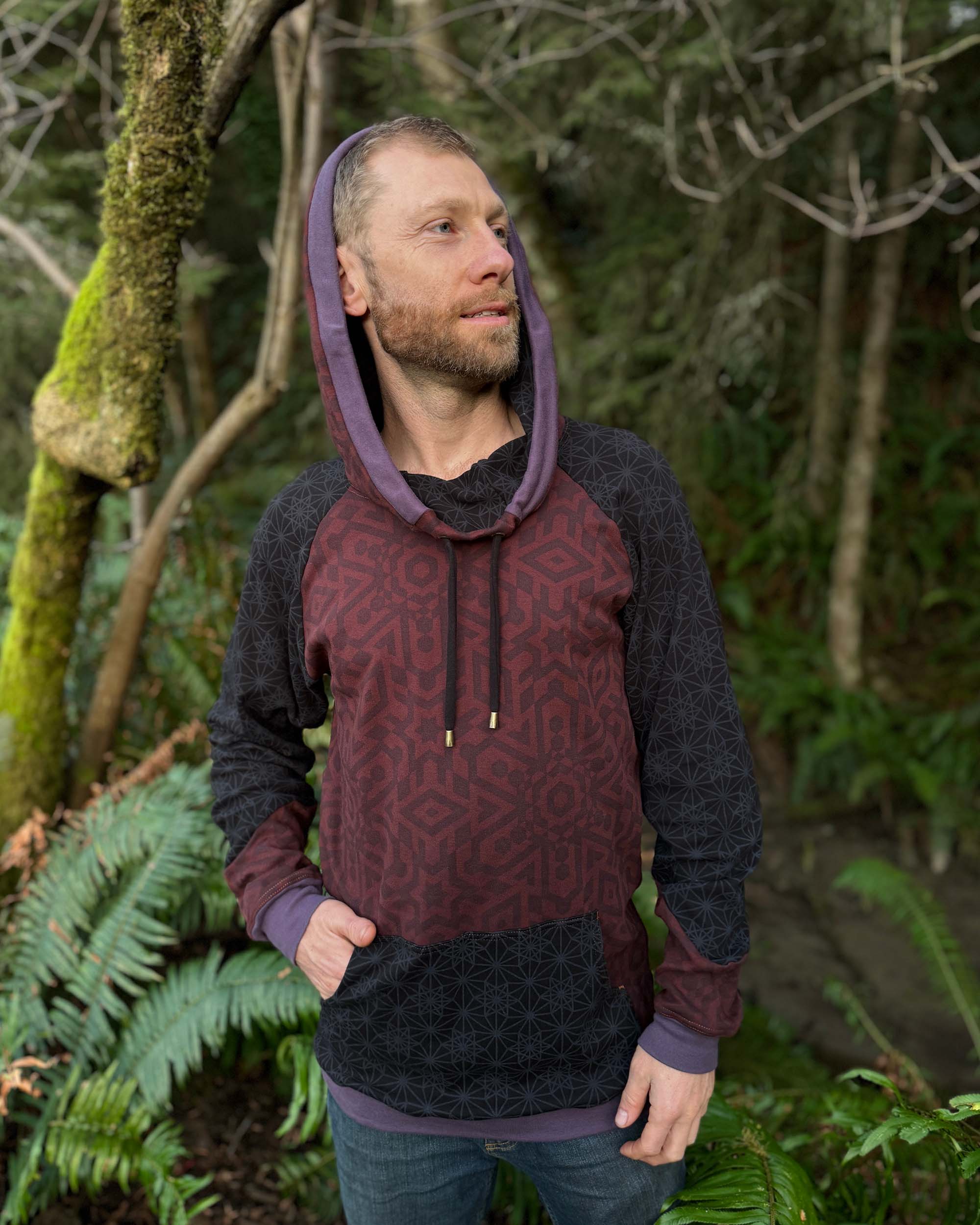 Organic cotton extra long unisex hoodie, reddish brown fabric with black and purple accents.