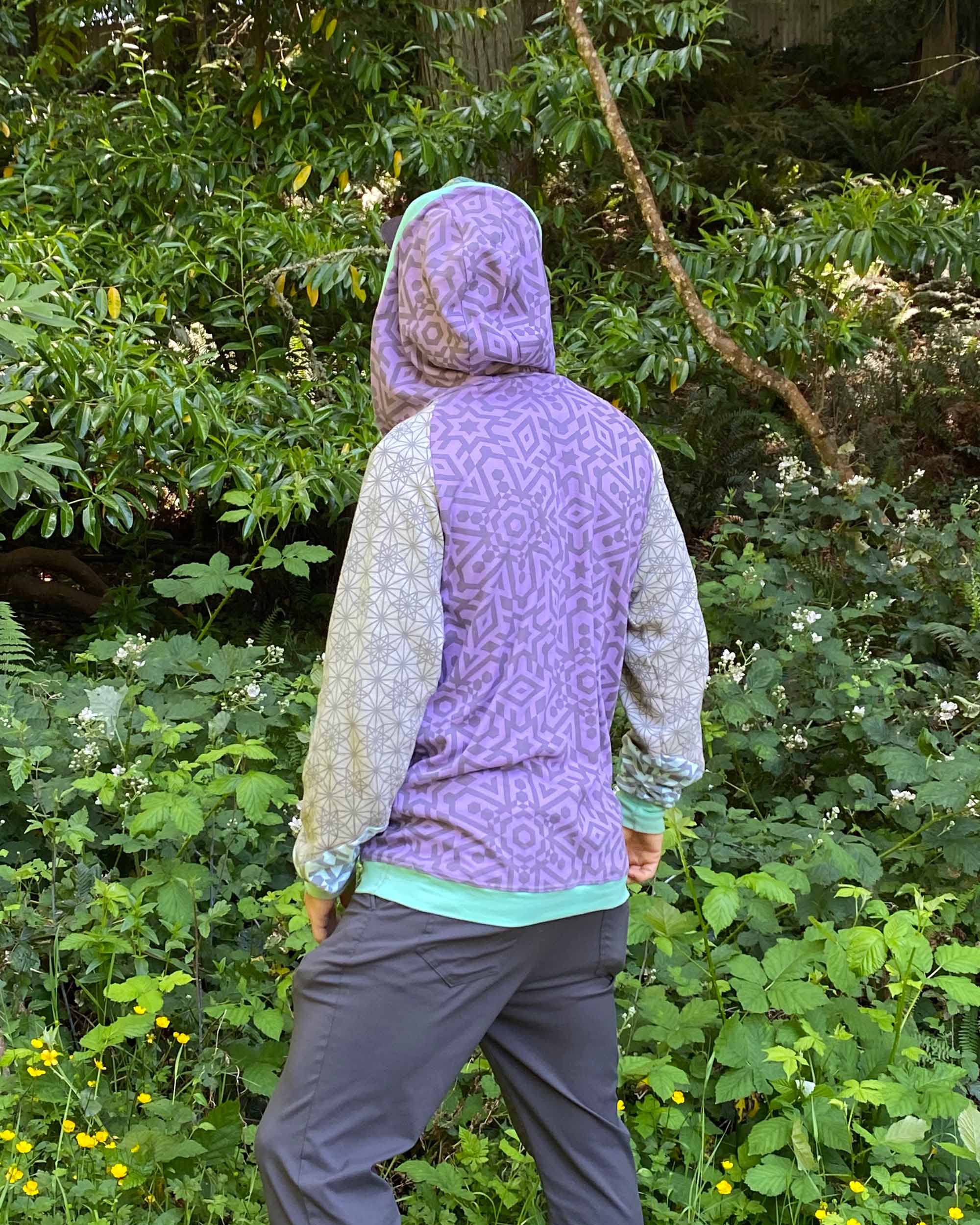Organic cotton hoodie, lavender and grey fabric with geo print, back  view on male model.
