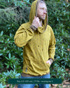 Organic cotton extra long unisex hoodie, yellow fabric with geometric print, right side view of male model.