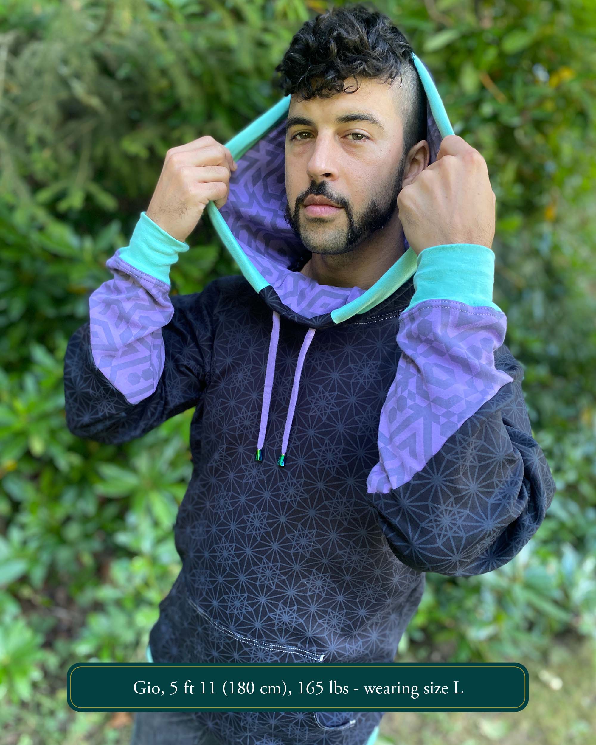 Organic cotton hoodie, black with sacred geometry print, front view worn by male model.