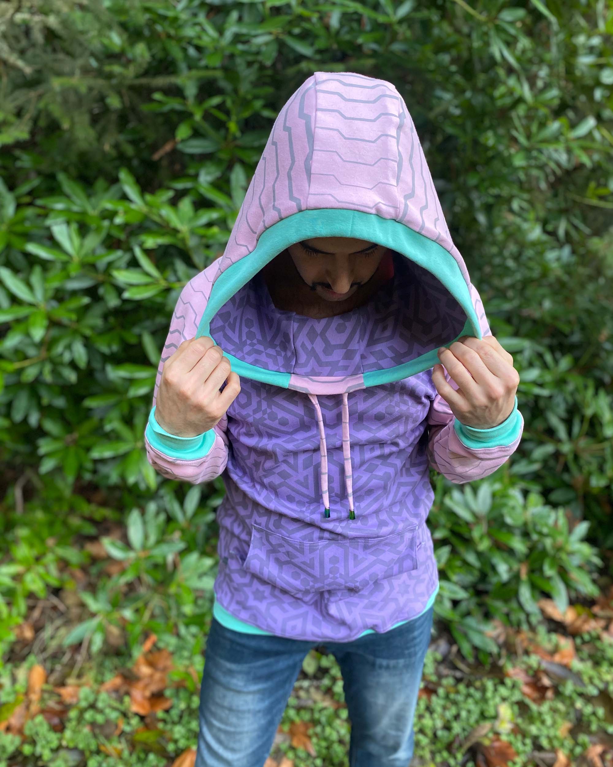 Organic cotton cowl hoodie, lavender and pink fabric with geo print, front  view on male model.