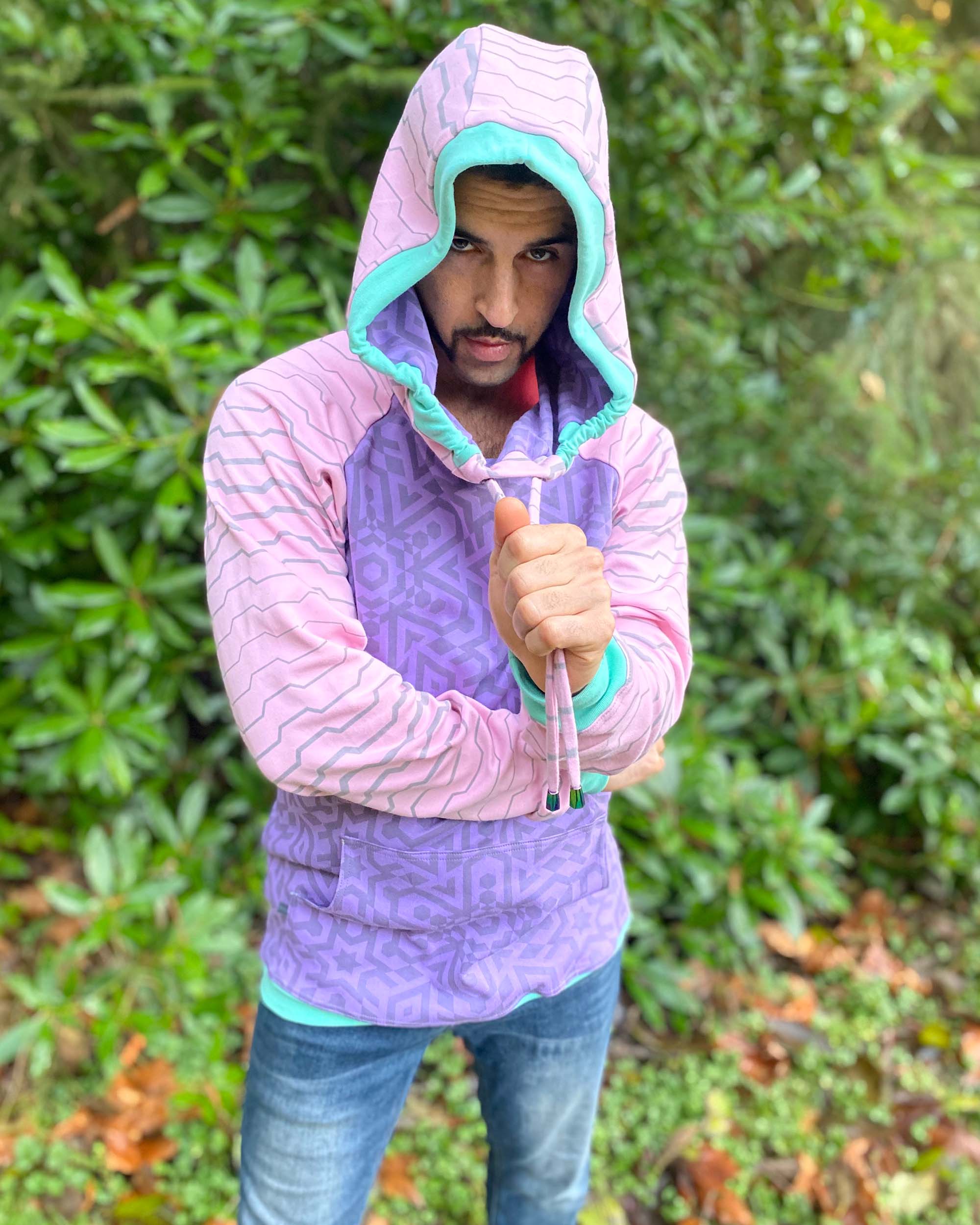 Organic cotton cowl hoodie, lavender and pink fabric with geometric print, front  view on male model.