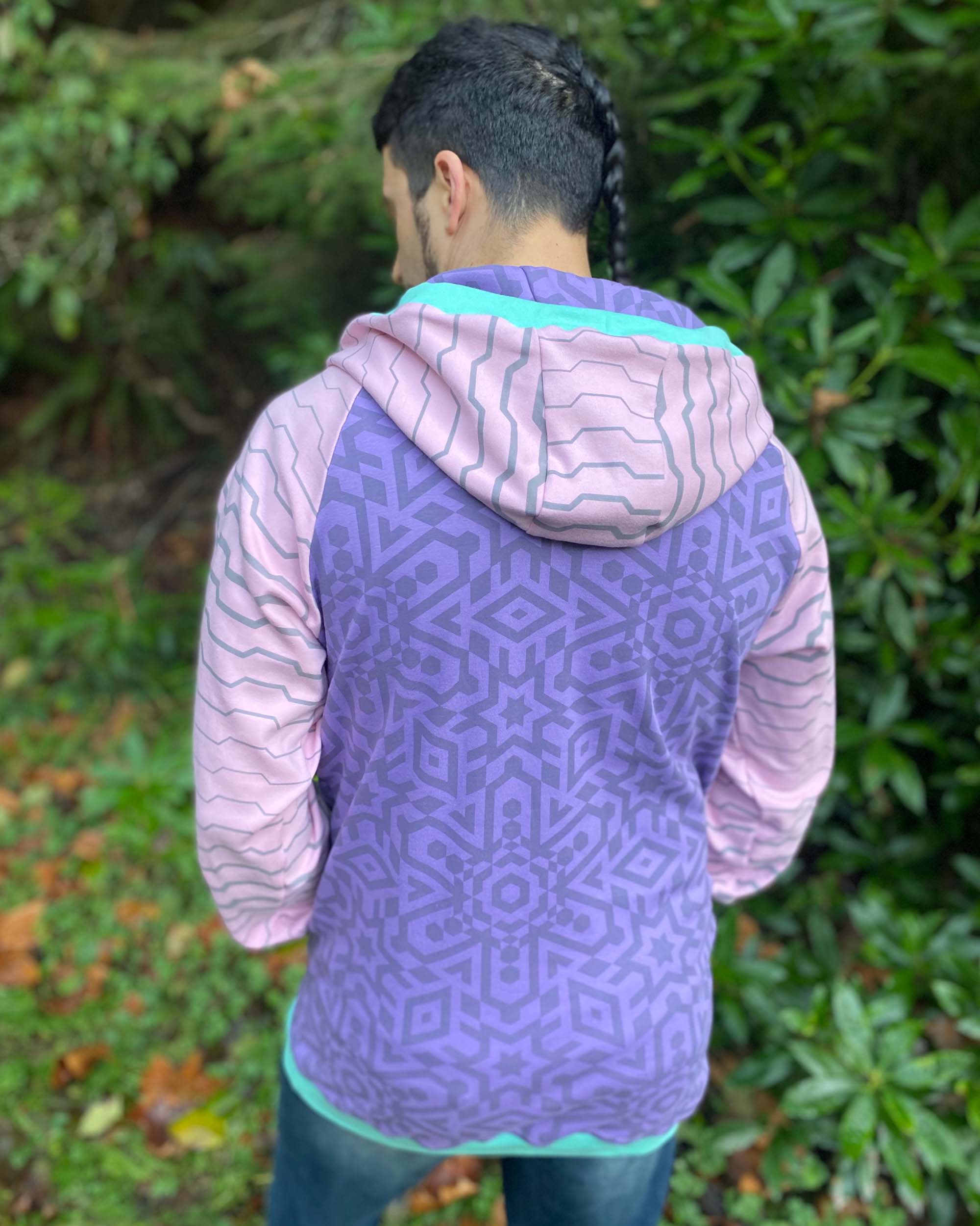 Organic cotton hoodie, lavender and pink fabric with geometric print, back  view on male model.