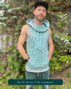 Organic cotton sleeveless hoodie, mint with geometric print fabric, front view on male model.
