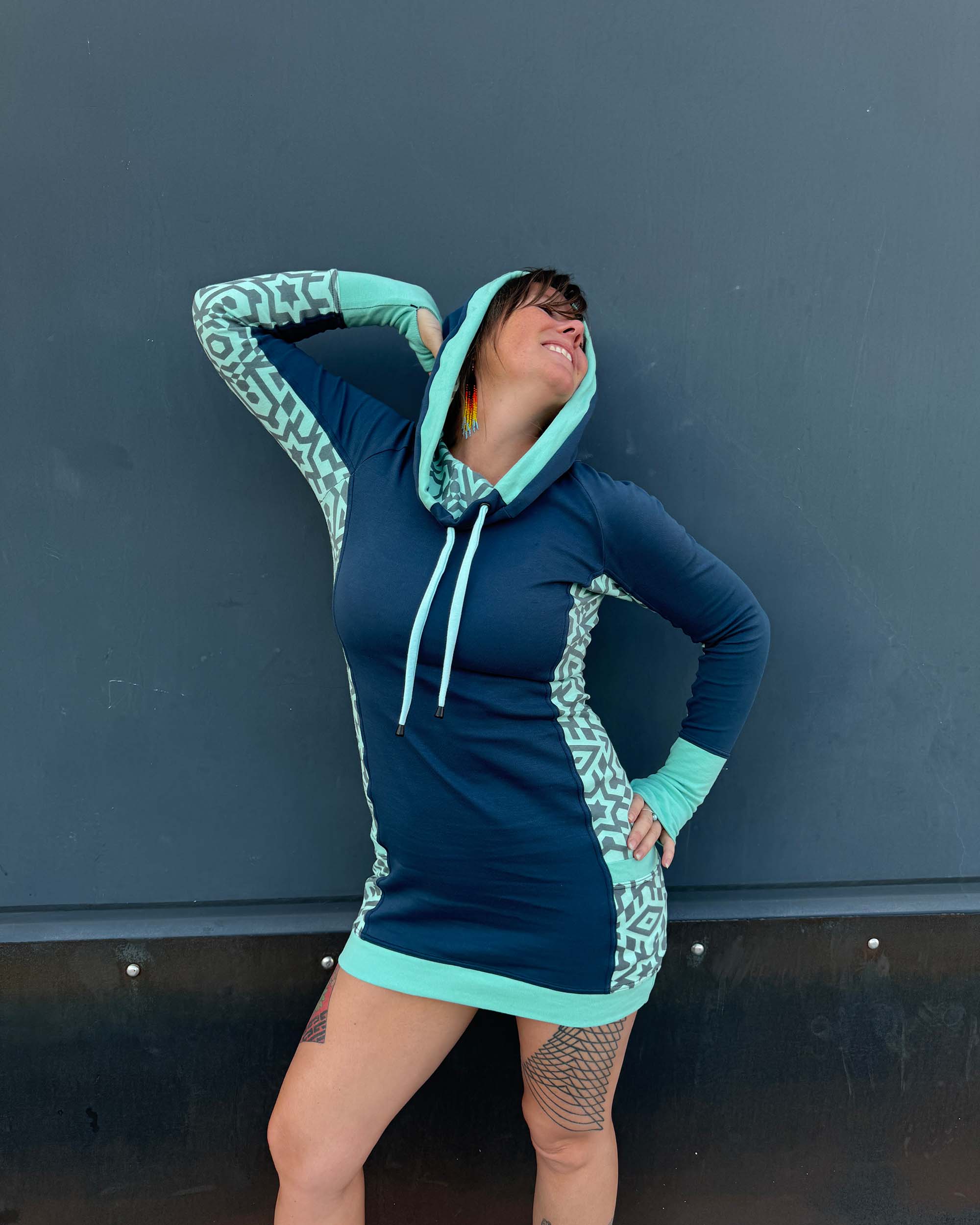 Organic cotton hooded tunic dress, blue and mint geometric mint fabric, front view on model.
