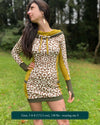 Organic cotton hooded tunic dress, undyed and yellow fabric with geometric print, front view on model.