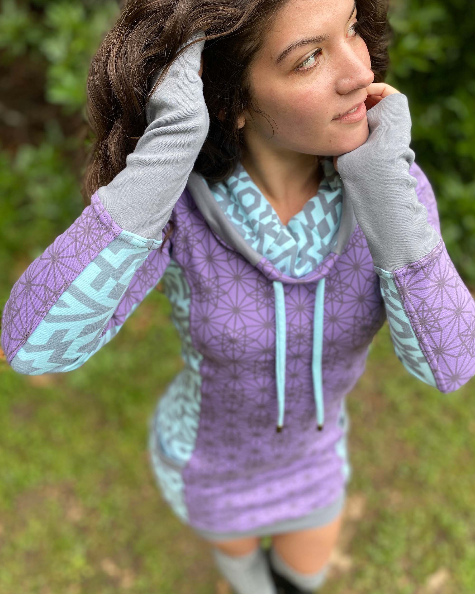 Organic cotton hooded tunic dress, lavender and mint fabric with geometric print, detail view of fabric.