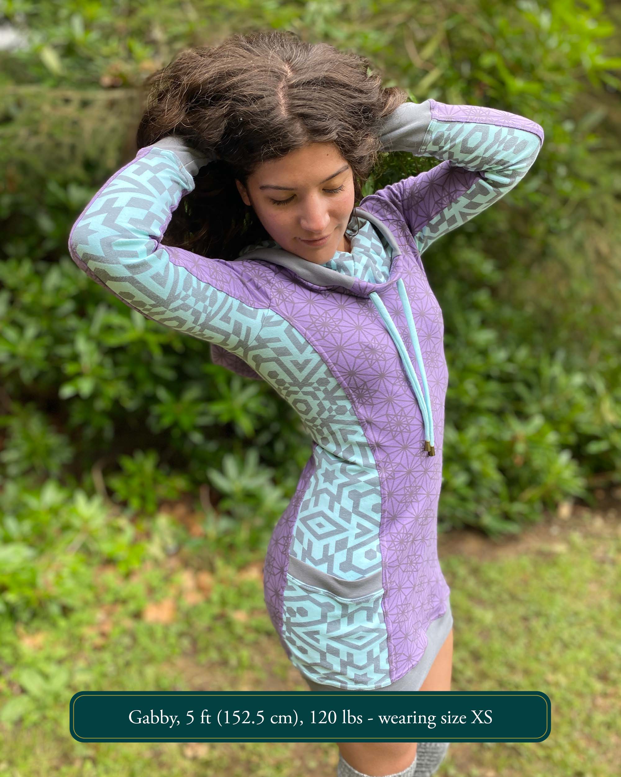 Organic cotton hooded tunic dress, lavender with geometric mint fabric accents, right side view on model.