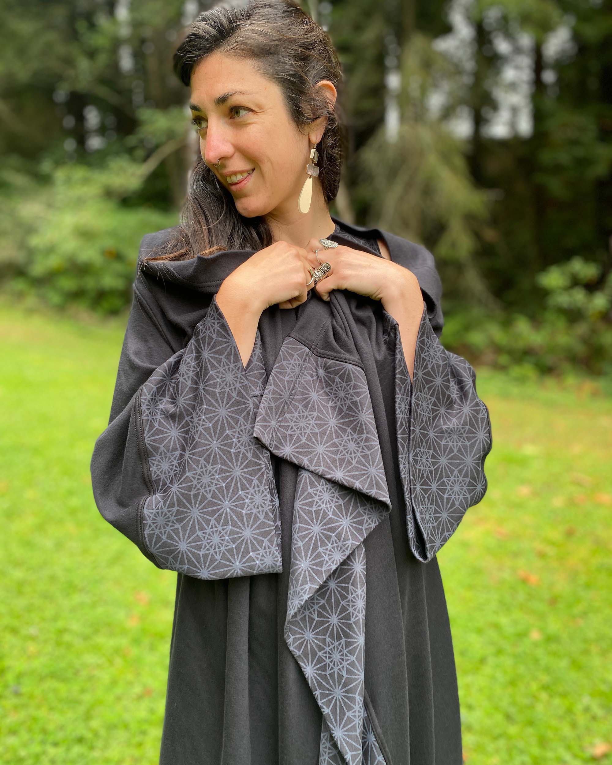 Organic cotton kimono, black with geometric printed accents, detail view of fabrics.