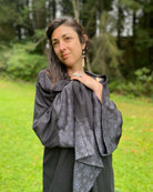 Organic cotton kimono, black with geometric printed accents.