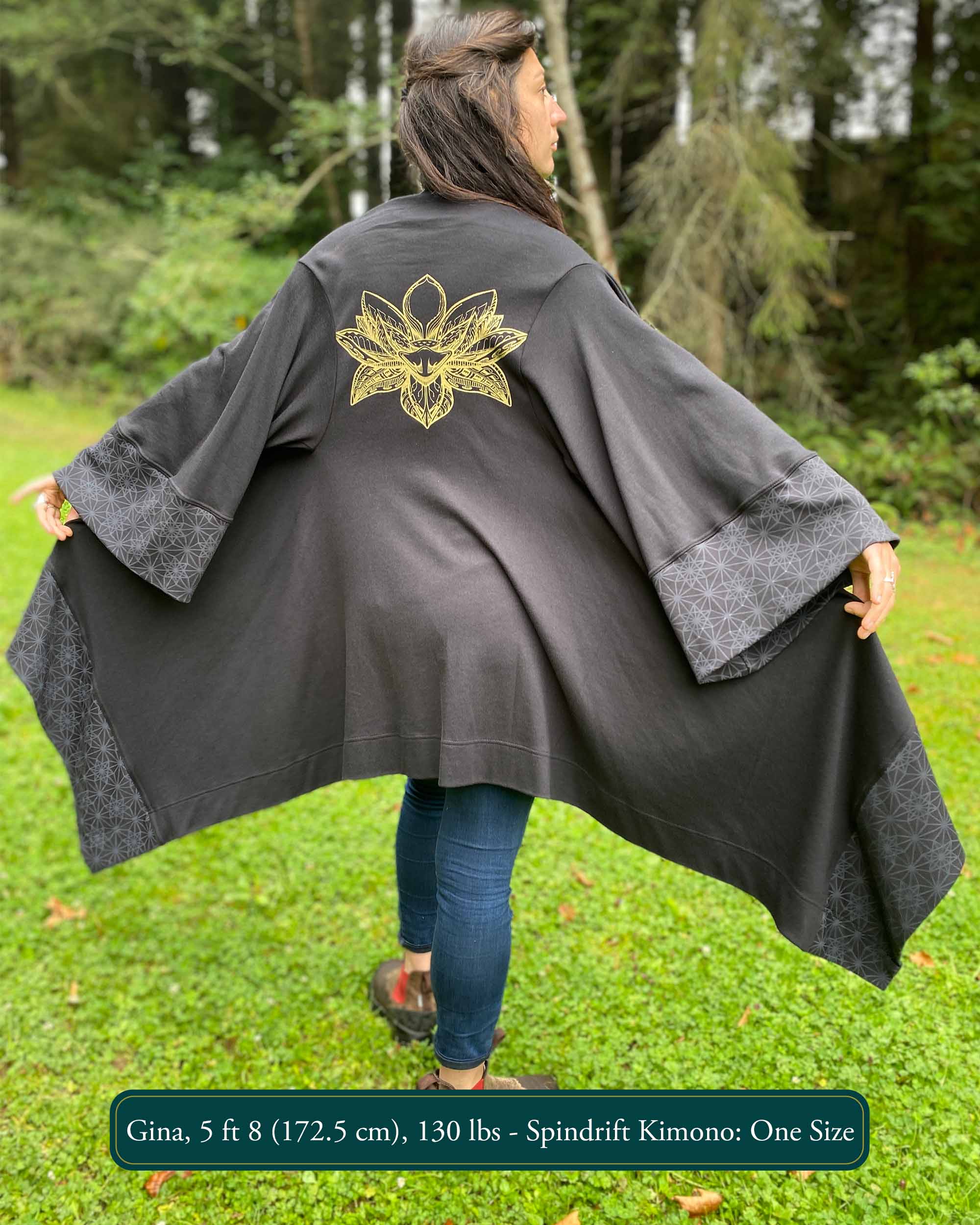 Organic cotton kimono, black fabric with gold lotus printed on back, back view on female model.