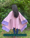 Organic cotton kimono, pink with geometric print and lavender accents, back view on female model.