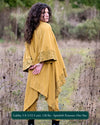 Organic cotton kimono, yellow fabric with geometric print accents, back view on model in nature.