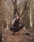 Organic cotton matching hooded tank top and shorts, black fabric with geometric print, worn by male model.
