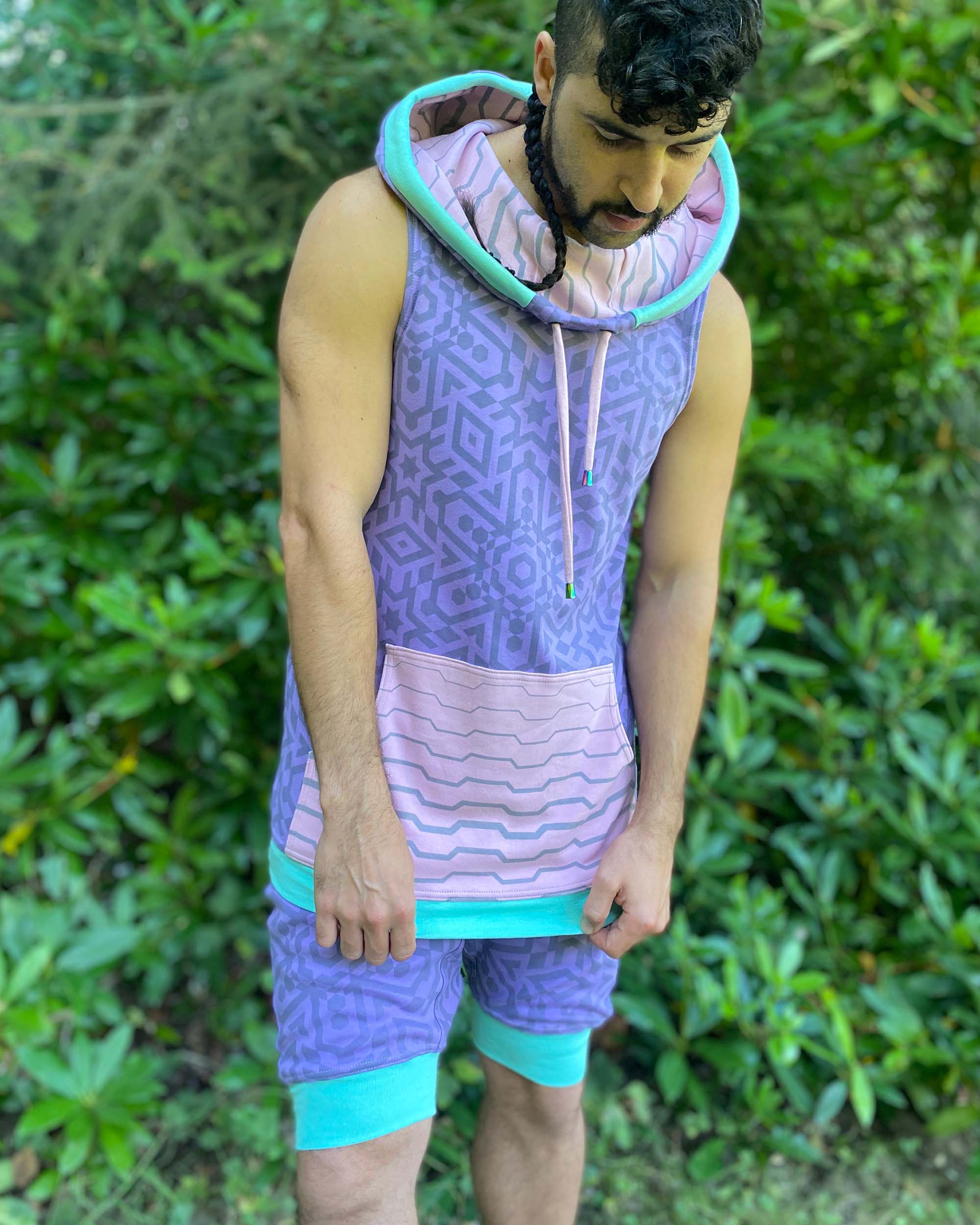 Hooded tank top and drop crotch shorts, lavender fabric with geometric print, front view on model.