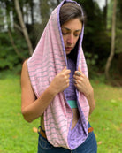 Lavender and pink organic cotton two tone infinity scarf with geometric prints, front right side view on female model.