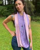 Lavender and pink organic cotton two tone infinity scarf with geometric prints, front view on female model.
