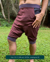 Organic cotton drop crotch shorts, brown fabric with geometric print, right side view on male model.