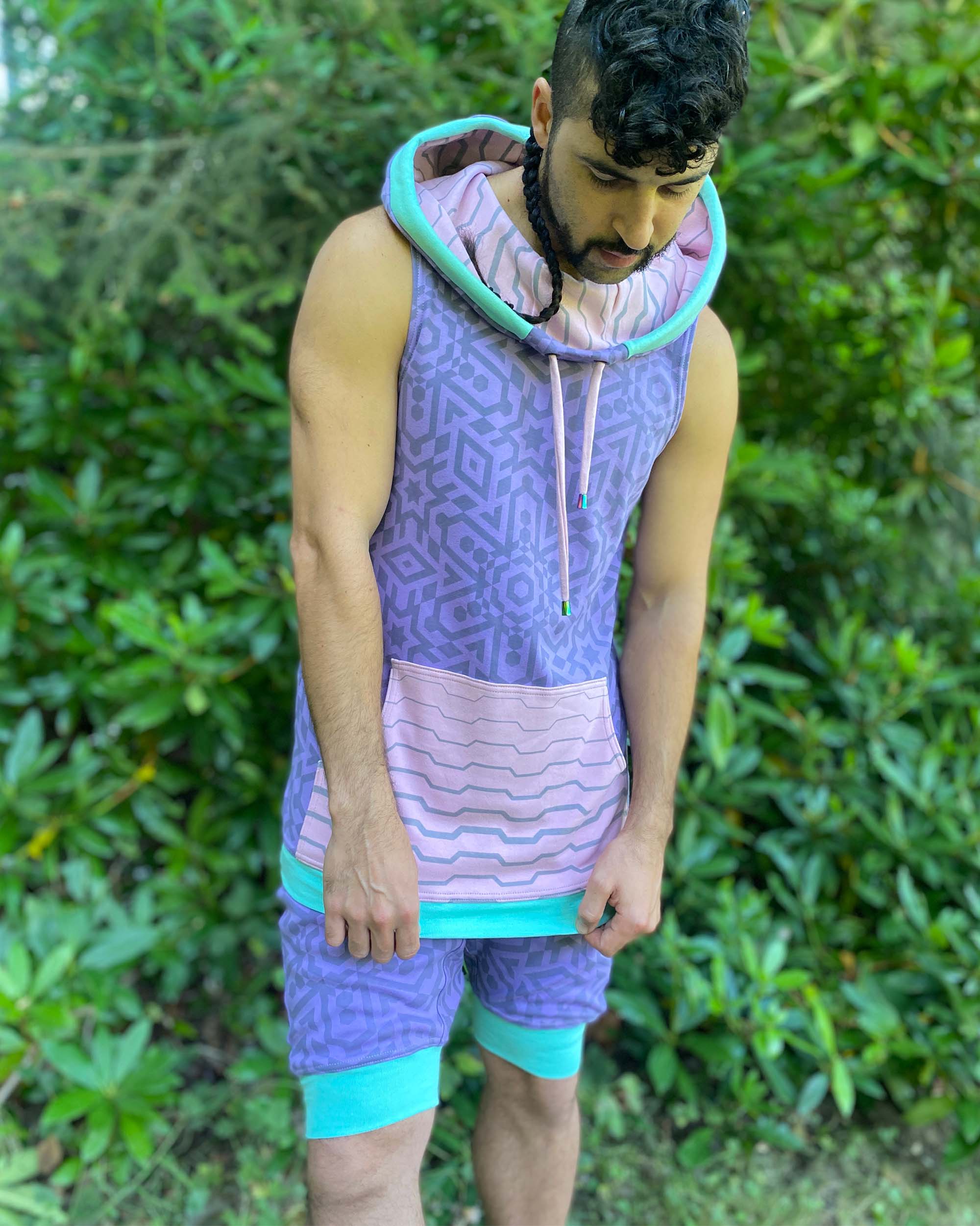 Organic cotton hooded tank top and matching shorts, lavender fabric with geometric print, front view on model.  