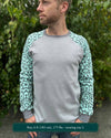 Organic cotton long sleeve shirt, grey with mint geometric sleeves, front view on model.