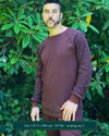 Organic cotton long sleeve shirt, brown with geometric sleeves, front view on model.