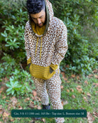Men's matching two piece sweatsuit, geometric print, organic fabric, front view, worn on model.