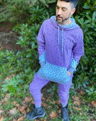 Men's matching two piece sweatsuit, lavender colored fabric with geo print, front view worn by model.