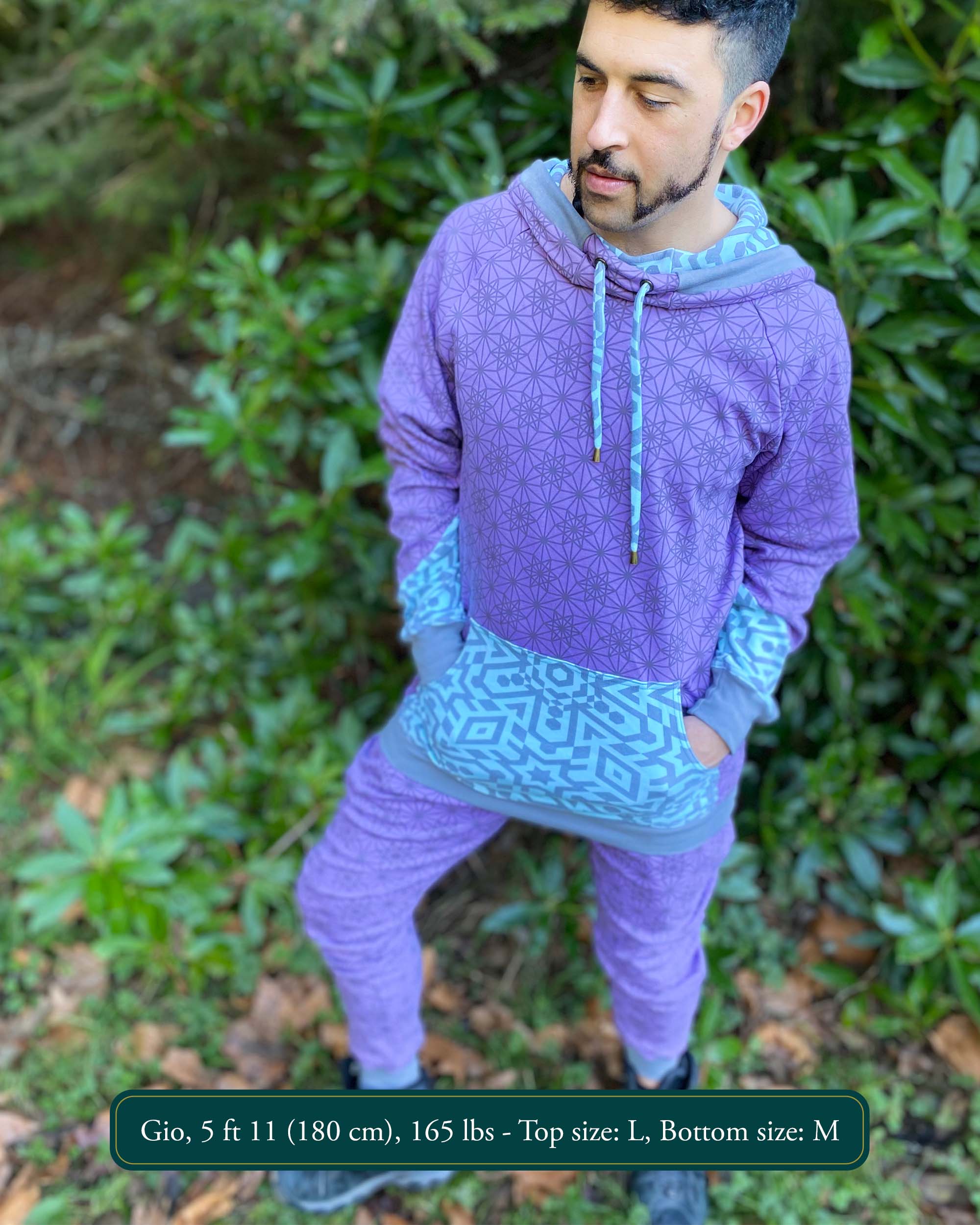 Men's matching two piece sweatsuit, lavender fabric and geometric print, front view worn by male model.