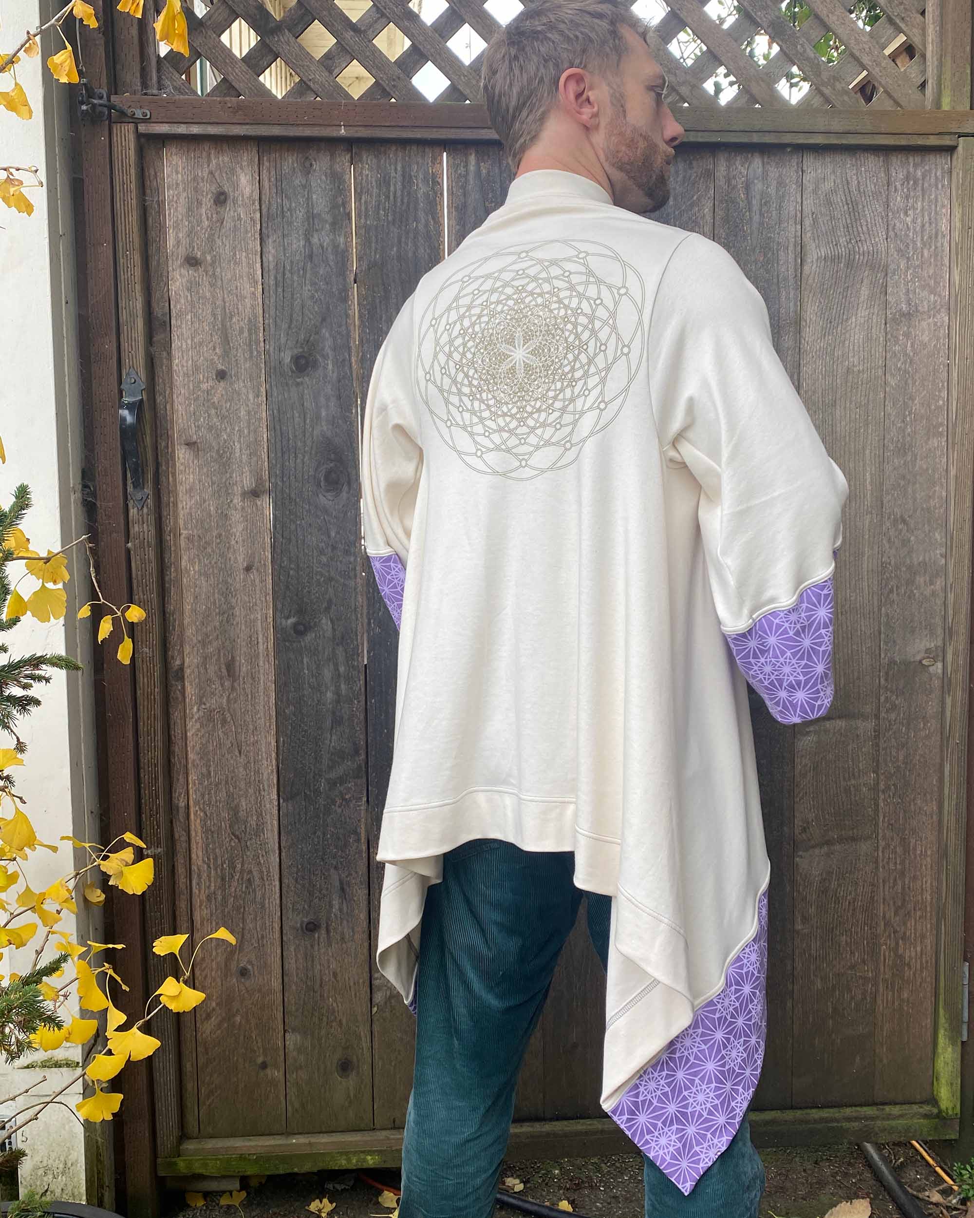 Organic cotton kimono, undyed with gold sacred geometry print, back view on male model.