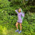 Women's lavender long sleeve pullover hooded dress with pockets. Deep cowl lined hood. Made in the USA from organic cotton.