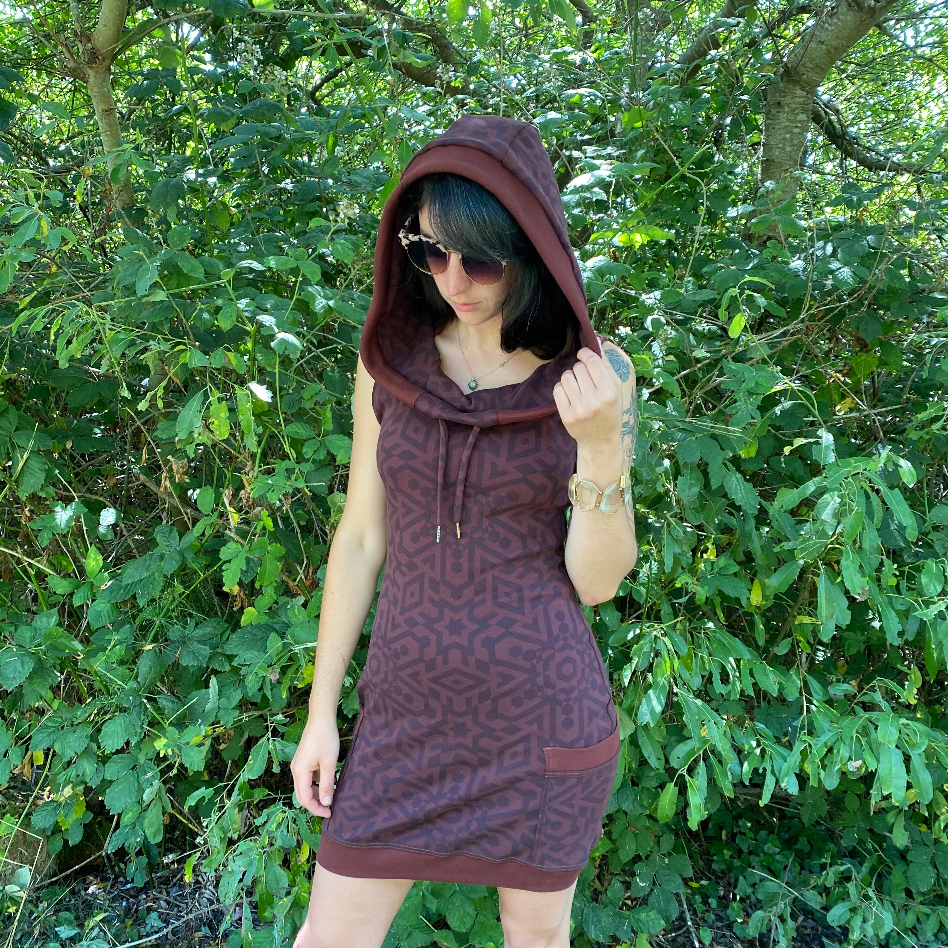 Sleeveless brown hoodie dress with pockets for women. Sacred geometry design. Festival wear made in USA from organic cotton.