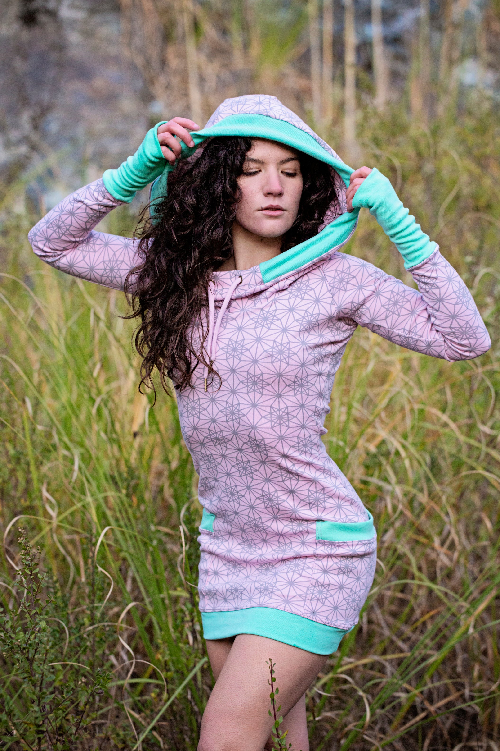 Pink hoodie dress with sacred geometry design. Deep drawstring hood. Festival wear made in the USA from organic cotton.