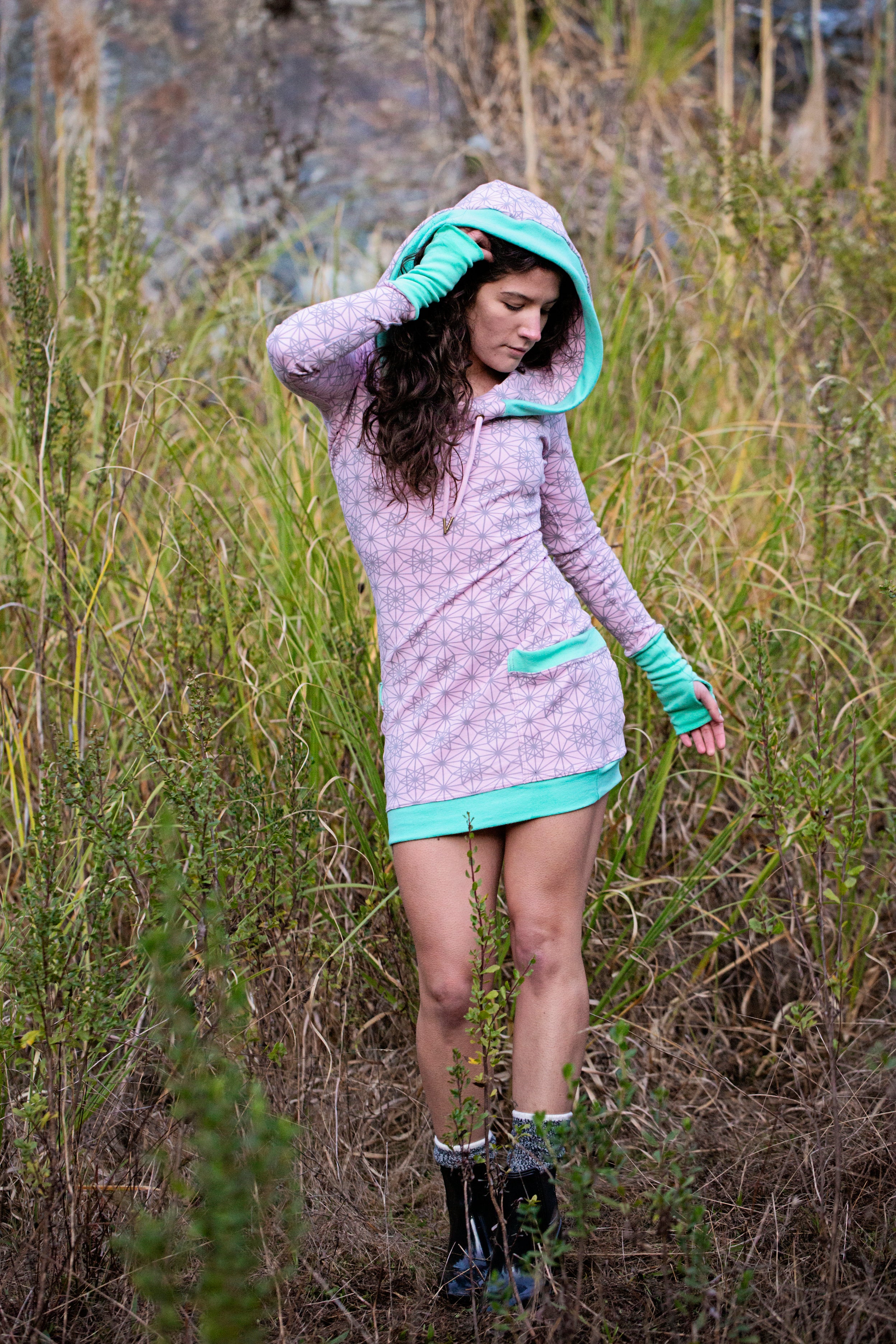 Pink hoodie dress with sacred geometry design. Deep drawstring hood. Festival wear made in the USA from organic cotton.